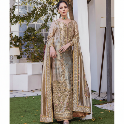 Full-length view of a model wearing the Samar golden bronze organza traditional Pakistani wedding dress, showcasing its elegant drape and regal color.`
	2.	`Close-up of the Samar dress bodice, highlighting the premium organza fabric and the rich golden bronze tone of this luxury eastern wear.`
	3.	`Detailed shot of the Samar dress, emphasizing the traditional craftsmanship and the sophisticated silhouette perfect for desi weddings.`
	4.	`Back view of the model in the Samar golden bronze organza dress, illus
