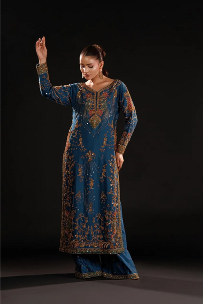 Azure Dynasty luxury royal blue Pakistani formal dress with intricate antique gold embroidery."