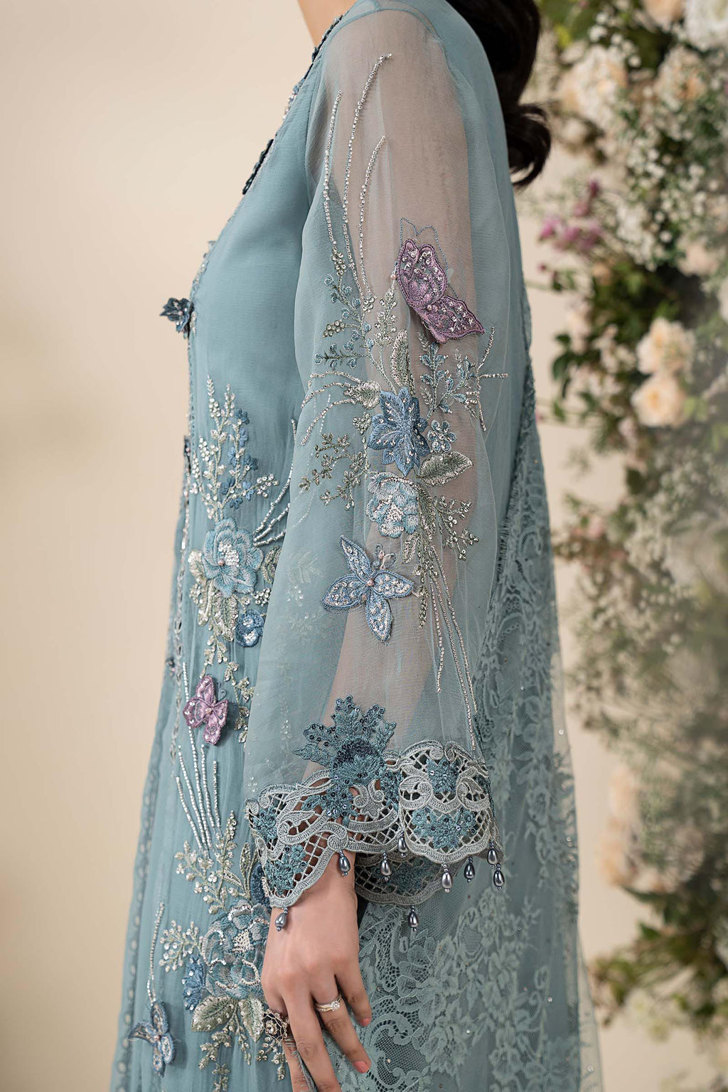 Maria B MCS-26-106 Aqua Chiffon Suit with 3D embroidery, pearl drops, and included tassels and beadwork, available in stitched and unstitched versions.