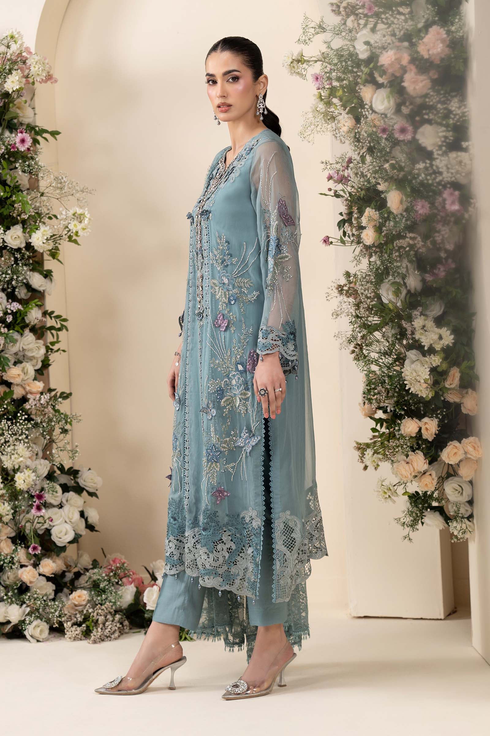 Maria B MCS-26-106 Aqua Chiffon Suit with 3D embroidery, pearl drops, and included tassels and beadwork, available in stitched and unstitched versions.
