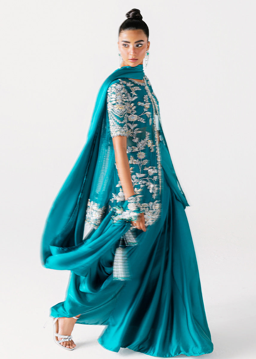 Zamrud Ayin turquoise green net gown by Sara Rohale Asghar - close up