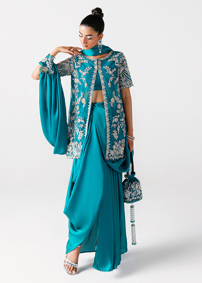 Zamrud Ayin turquoise green net gown by Sara Rohale Asghar - styled look